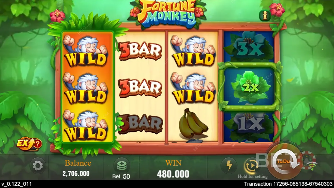 Gameplay do Fortune Monkey mostrando a selva tropical e os símbolos do jogo